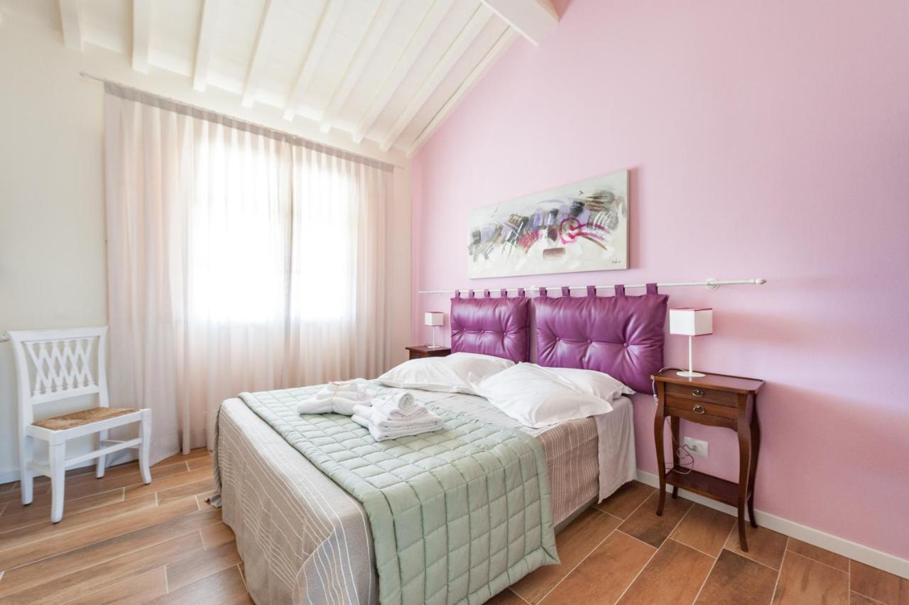 Appartamento Le Residenze Chianni Esterno foto