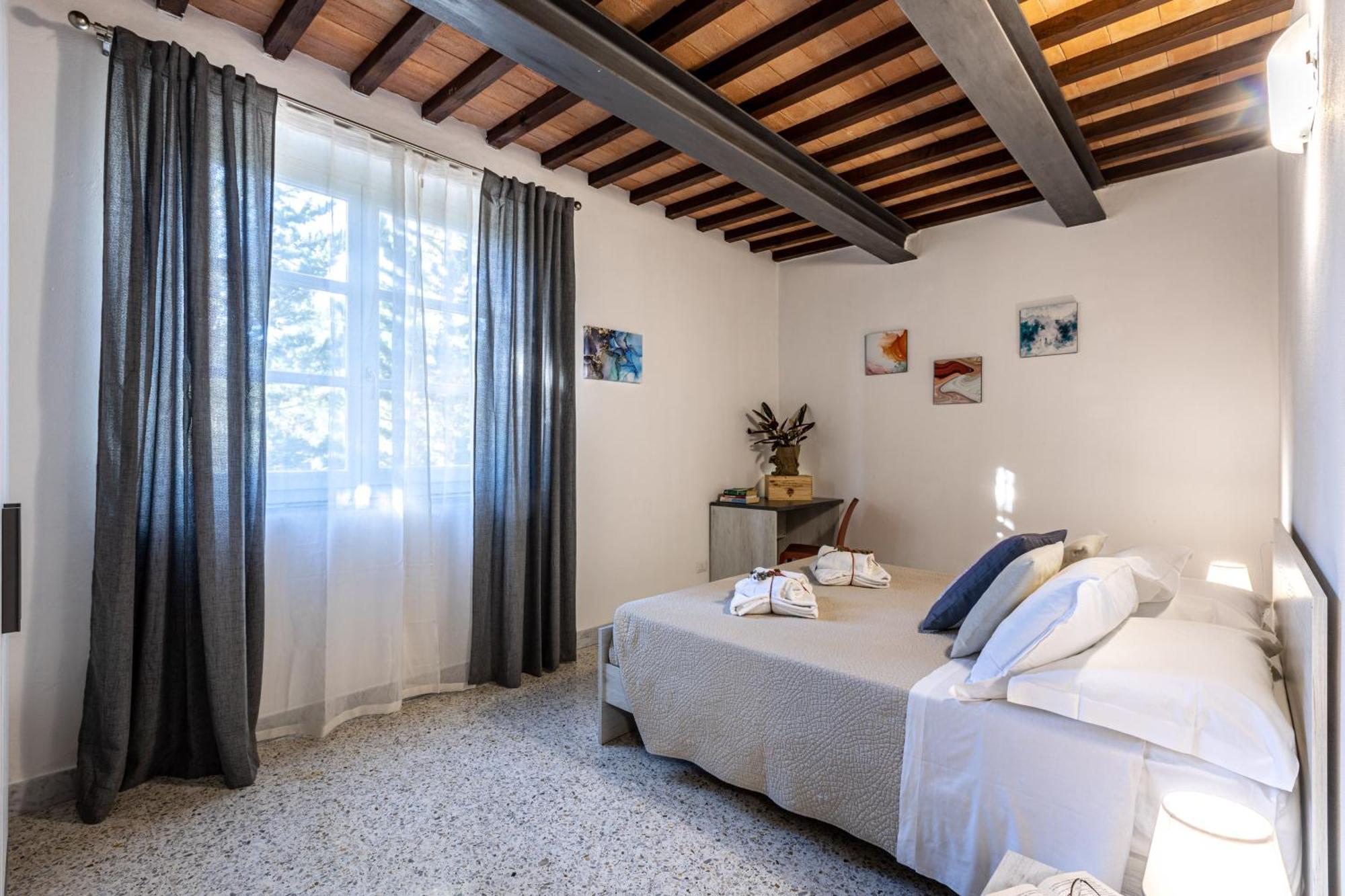 Appartamento Le Residenze Chianni Esterno foto